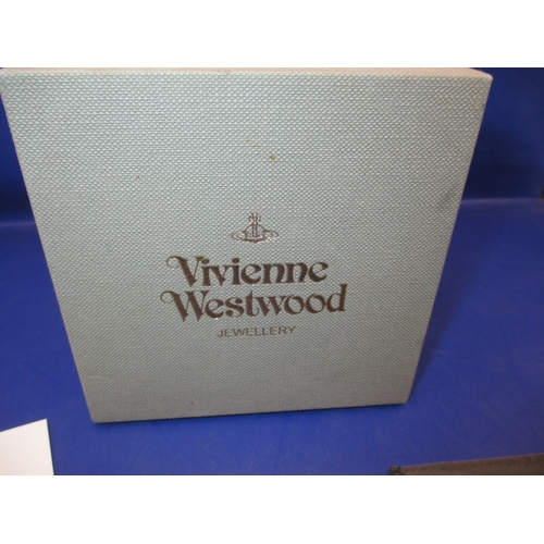 74 - A vintage Vivienne Westwood necklace in original box with pouch and paperwork