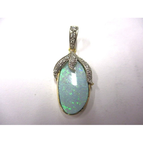 7 - An 18ct gold, opal and diamond necklace pendant, the opal measuring approx. 21x11mm, in good useable... 