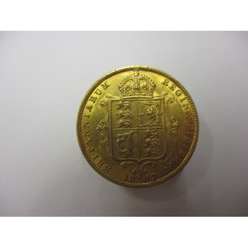 33 - A Victorian gold half sovereign dated 1887, having shield back, a circulated coin with very fine def... 