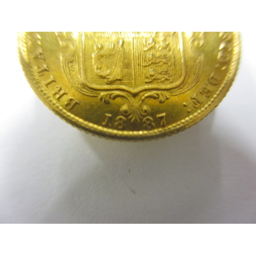 33 - A Victorian gold half sovereign dated 1887, having shield back, a circulated coin with very fine def... 