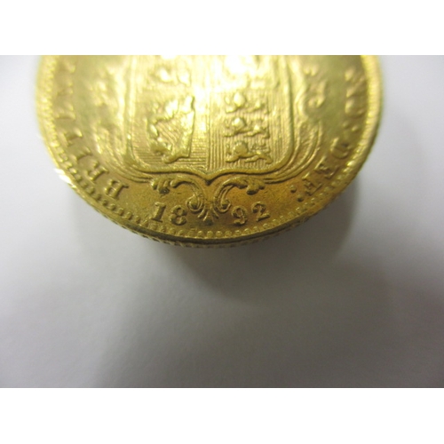 34 - A Victorian gold half sovereign date 1892, having shield back, a circulated coin with very fine defi... 