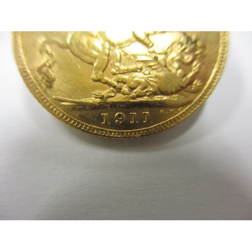 44 - A George V gold sovereign, dated 1911, a circulated coin with good definition of features