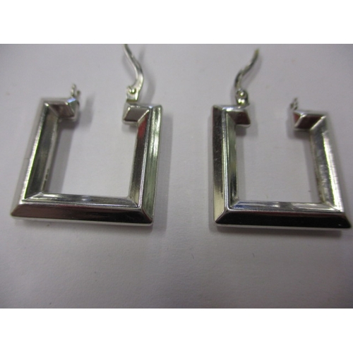 17 - A pair of 9ct white gold square form hoop earrings, in good pre-owned condition, approx. weight 2.3g