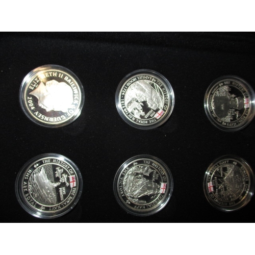 62 - A cased set of 18 proof £5 commemorative coins, “The History of the Royal Navy, all in plastic capsu... 