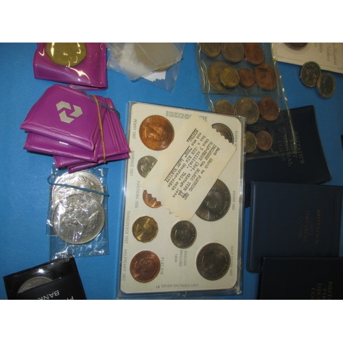 63 - A large quantity of collectable coins, to include Royal mint sets and some silver