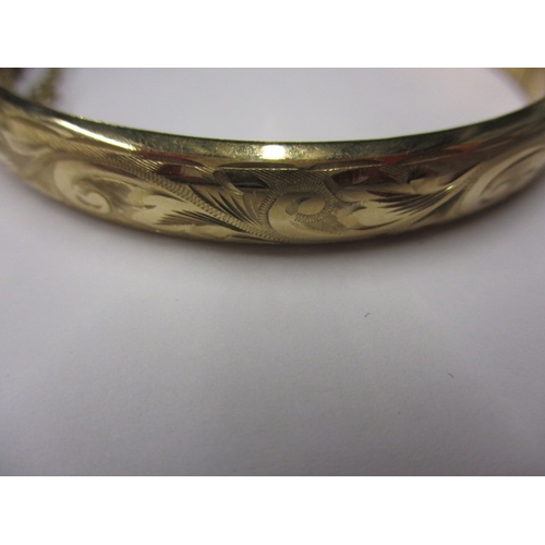 19 - A vintage 9ct yellow gold bangle, approx. diameter 6cm, approx. weight 10.9g in useable pre-owned co... 