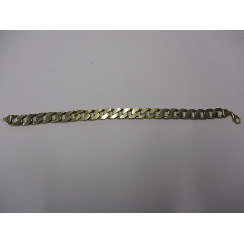 58 - A 9ct yellow gold flat curb link bracelet, approx. linear length 22cm, approx. weight 34g in useable... 