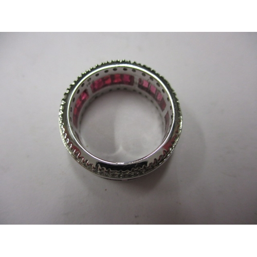 32 - An 18ct white gold, diamond and ruby eternity ring, approx. ring size ‘M1/2’, approx. weight 8.1g in... 