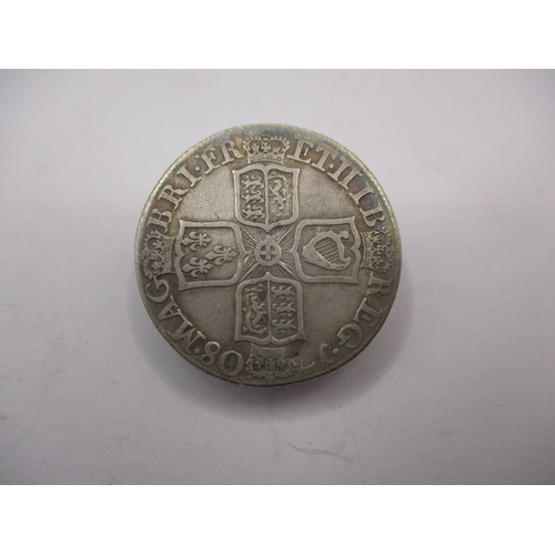 196 - A silver Queen Anne shilling, dated 1708, a circulated coin with reasonable definition of features