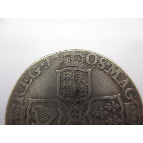 196 - A silver Queen Anne shilling, dated 1708, a circulated coin with reasonable definition of features