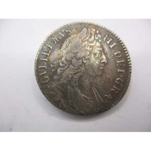 197 - A William III silver shilling dated 1696 with Norwich mint mark, a circulated coin with fine definit... 