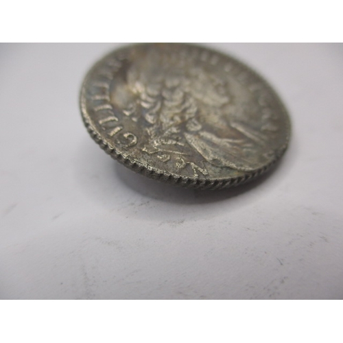 197 - A William III silver shilling dated 1696 with Norwich mint mark, a circulated coin with fine definit... 