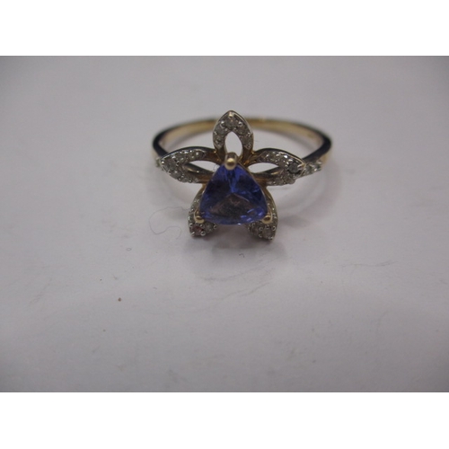 8 - A 9ct yellow gold, diamond and tanzanite dress ring, having central triangular stone, approx. ring s... 