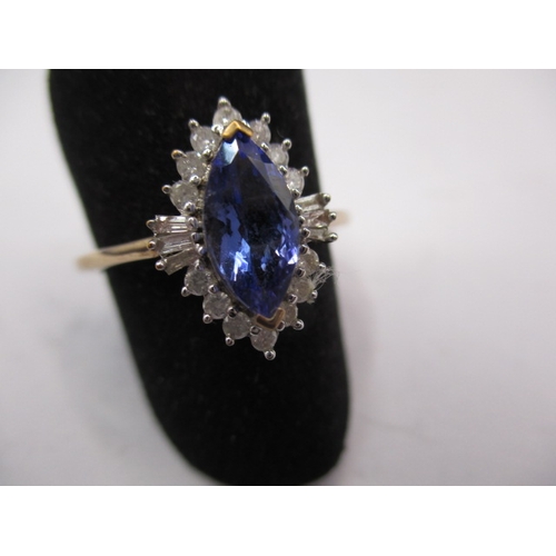 10 - A 9ct yellow gold diamond and tanzanite boat shaped halo ring, approx. ring size ‘R ½ ‘, approx. wei... 