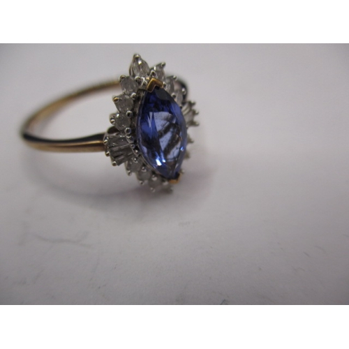 10 - A 9ct yellow gold diamond and tanzanite boat shaped halo ring, approx. ring size ‘R ½ ‘, approx. wei... 