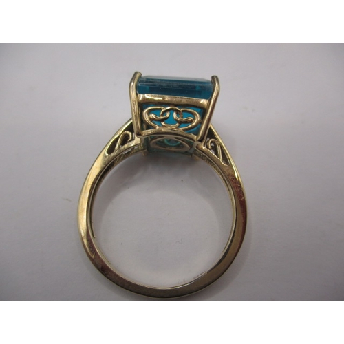 23 - A 9ct yellow gold dress ring with large turquoise blue crystal, approx. ring size ‘Q’, approx. weigh... 