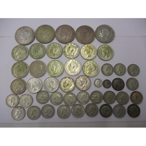 210 - A parcel of pre-decimal part silver coins, all in circulated condition with some very fine grades, a... 