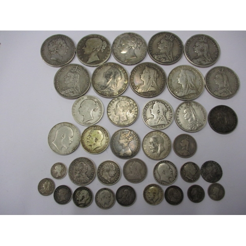 211 - A parcel of Georgian and later silver coins, to include crowns, all in circulated condition with som... 