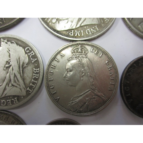 211 - A parcel of Georgian and later silver coins, to include crowns, all in circulated condition with som... 