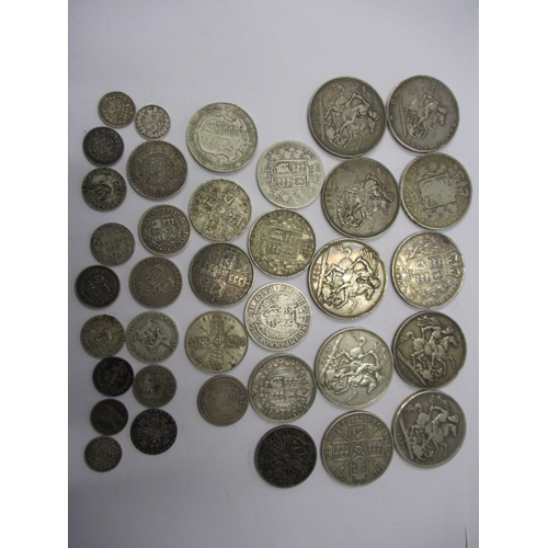 211 - A parcel of Georgian and later silver coins, to include crowns, all in circulated condition with som... 