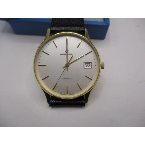 106 - A Garrards gold cased gents wrist watch, in unused condition with original box, inscribed to back, n... 