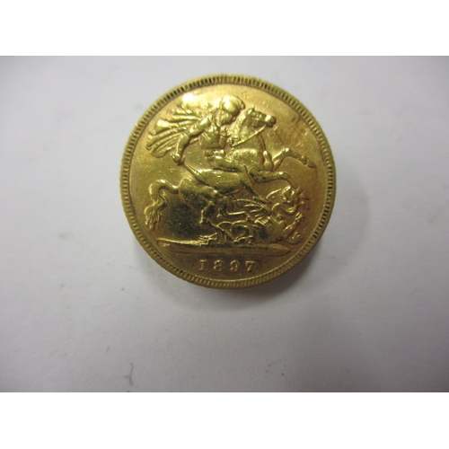 A Victorian gold half sovereign dated 1897, a circulated coin with fine definition of features