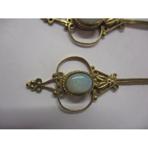 81 - A pair of 9ct gold and opal pendant earrings, in the art nouveau style, in useable pre-owned conditi... 