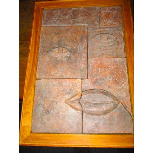 350 - Two contemporary stylized terracotta wall panels, made from sectional tiles in the cubist style, eac... 