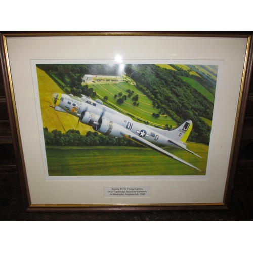 355 - A framed photograph of a WWII Boeing B17G Flying Fortress over Cambridge  American war Cemetery, dat... 