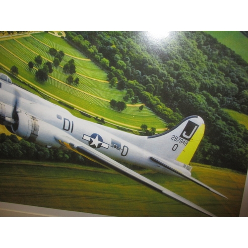 355 - A framed photograph of a WWII Boeing B17G Flying Fortress over Cambridge  American war Cemetery, dat... 