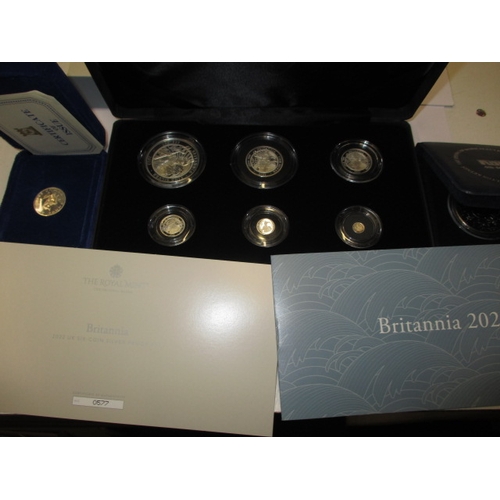 A Royal Mint 2022 Britannia .999 silver 6 coin proof set and  2 other coins, all in original packaging
