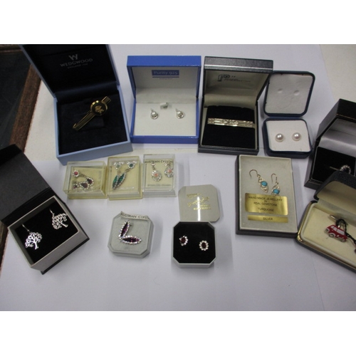 226 - A parcel of new old stock costume jewellery, to include silver earrings, in original retailers boxes