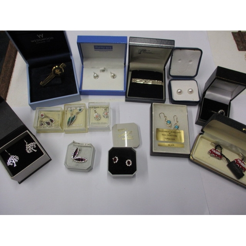 226 - A parcel of new old stock costume jewellery, to include silver earrings, in original retailers boxes