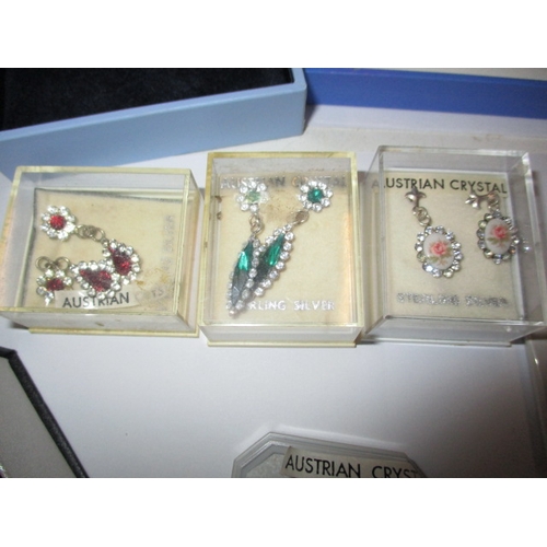 226 - A parcel of new old stock costume jewellery, to include silver earrings, in original retailers boxes