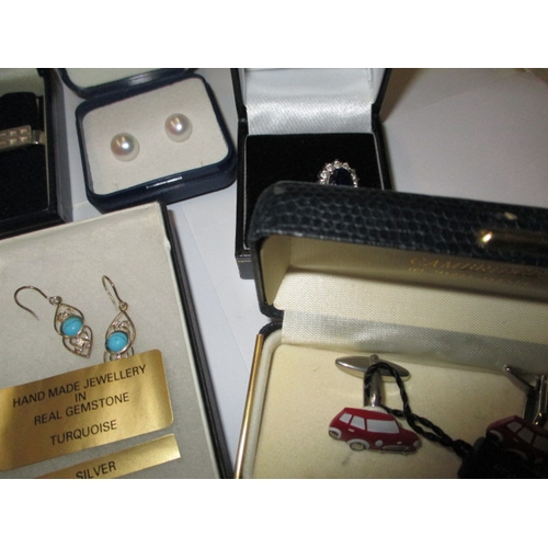 226 - A parcel of new old stock costume jewellery, to include silver earrings, in original retailers boxes