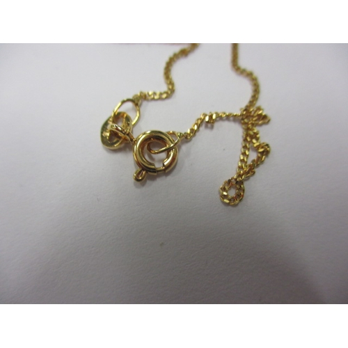 46 - A 9ct yellow gold necklace with diamond set pendant, new old stock in retailers box