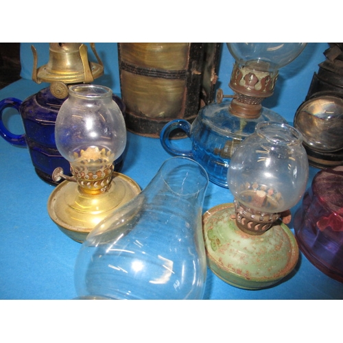 22 - A quantity of vintage oil lamps and parts, all in used condition