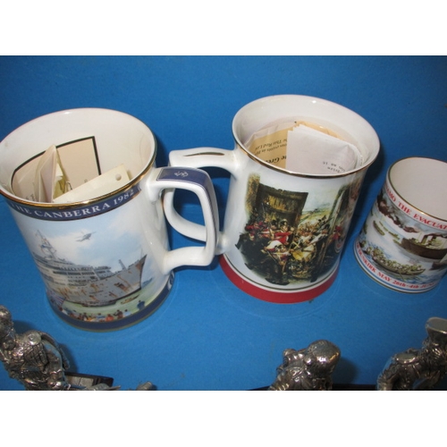 68 - A quantity of collectable die-cast military figures and military commemorative tankards, all in used... 