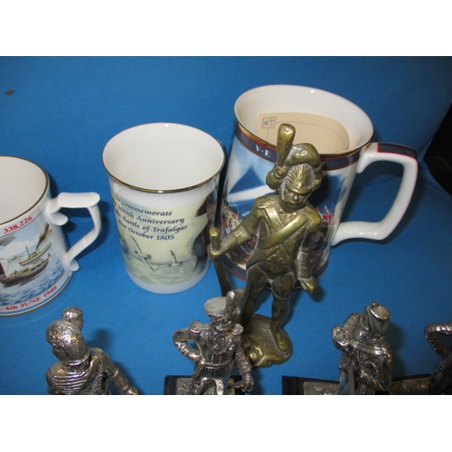 68 - A quantity of collectable die-cast military figures and military commemorative tankards, all in used... 