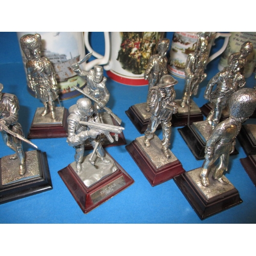 68 - A quantity of collectable die-cast military figures and military commemorative tankards, all in used... 