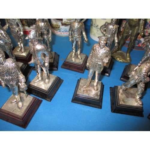 68 - A quantity of collectable die-cast military figures and military commemorative tankards, all in used... 