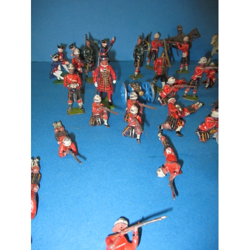 69 - A quantity of vintage die-cast model soldiers, various sizes, all in play worn condition