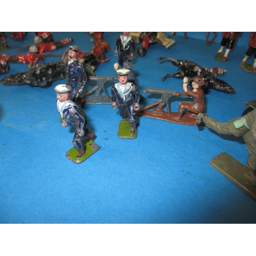 69 - A quantity of vintage die-cast model soldiers, various sizes, all in play worn condition