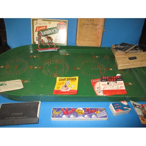 70 - A vintage bagatelle board and other vintage games and jokes, to include tin-plate boxers, all in use... 