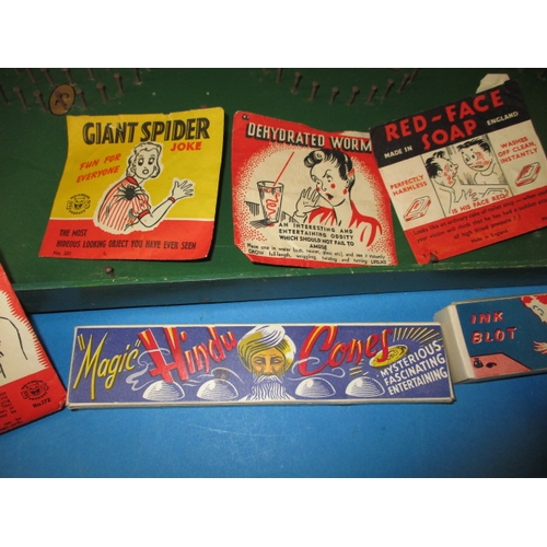 70 - A vintage bagatelle board and other vintage games and jokes, to include tin-plate boxers, all in use... 