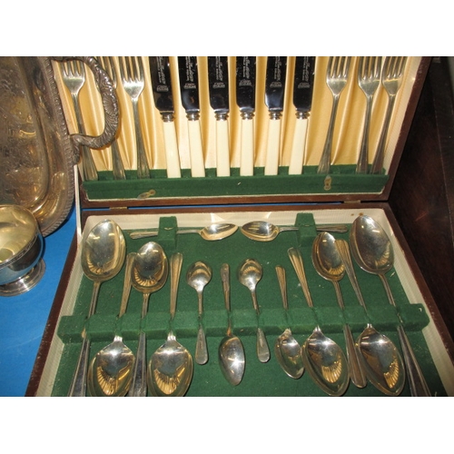 72 - A canteen of cutlery, a boxed silver plated dressing table set, collectable spoons and a tea set on ... 