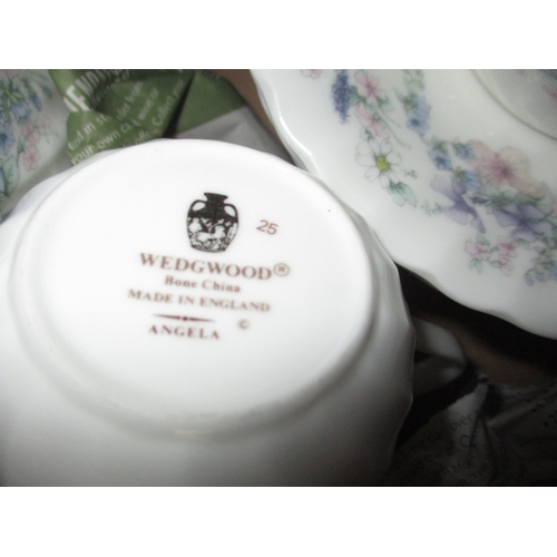 80 - 2 Wedgwood part tea services, one in ‘Candlelight’ design and one in ‘Angela’ design. Both with no o... 