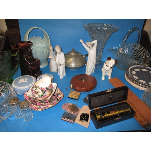 81 - A large quantity of general clearance items, to include lladro figures and cigarette lighters. All i... 