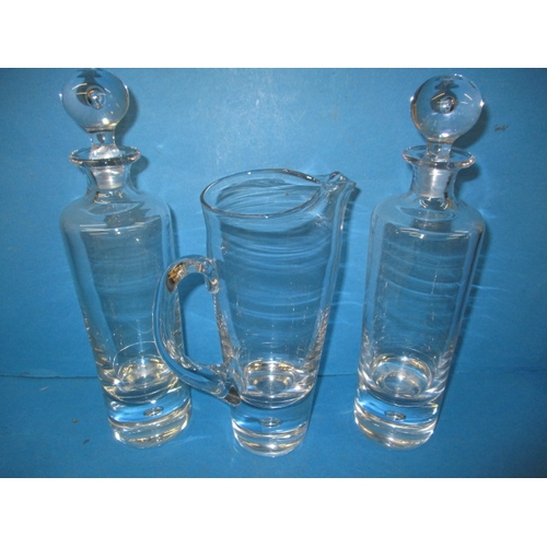 85 - A quantity of glass items to include a 7 piece lemonade set, 2 Kosta Boda glass decanters and matchi... 