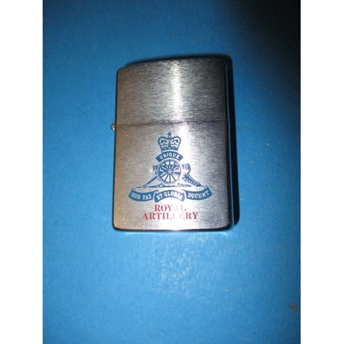 93 - A vintage Royal Artillery Zippo lighter in near unused condition